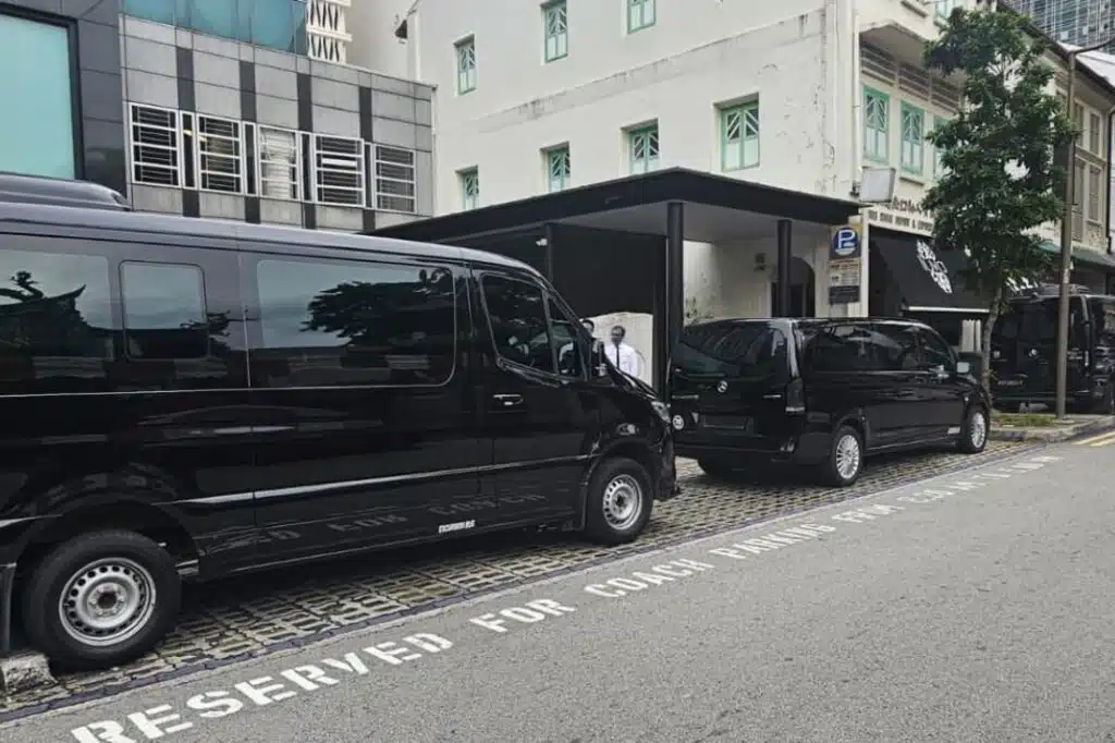 F1 week in Singapore relies on chauffeured vans reserved for coach parking near venues.