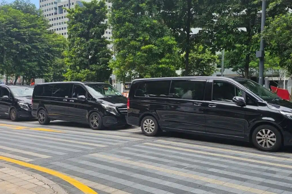 Private chauffeurs waiting curbside, an essential part of TOKEN2049 & Singapore