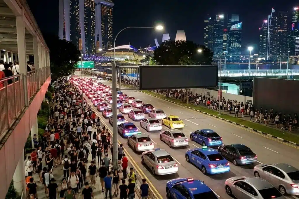 Crowds and queued taxis at Marina Bay, illustrating Token2049 & Singapore Grand Prix 2026 Travel Tips